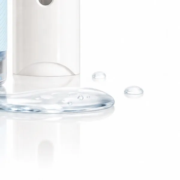 Clear, lightweight serum droplets on a white surface next to the applicator